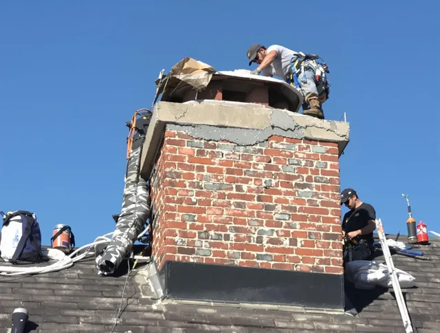Hialeah Chimney Sweep installing a custom chimney crown in Hialeah, FL