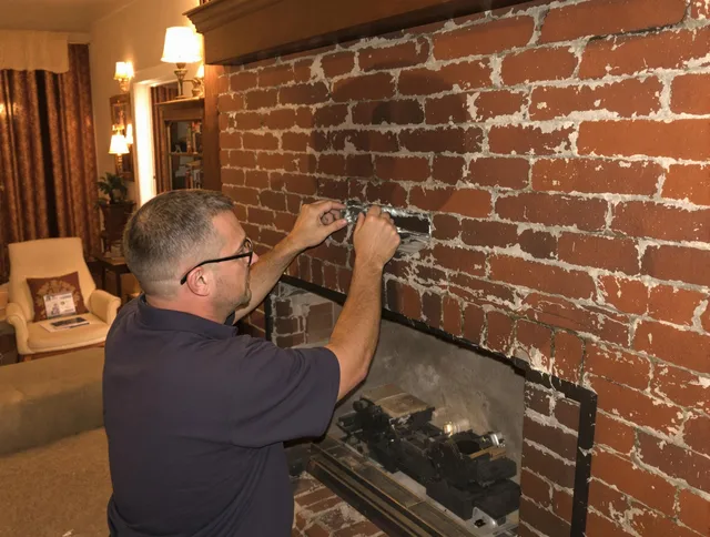 Hialeah Chimney Sweep expert fixing a fireplace in Hialeah, FL